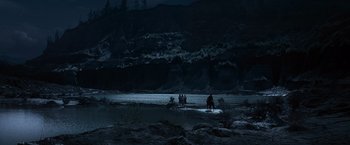 Movie still from “The Twilight Saga: Eclipse” (2010), directed by David Slade – A group of people riding horses in the dark near a lake; Extreme Wide shot, High angle