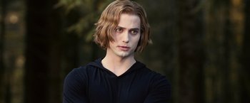 Movie still from “The Twilight Saga: Eclipse” (2010), directed by David Slade – A man with long hair and a black shirt is posing; Medium shot, Over the shoulder angle