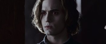 Movie still from “The Twilight Saga: Eclipse” (2010), directed by David Slade – A person with red eyes; Close Up shot, Over the shoulder angle