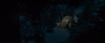 Movie still from “The Twilight Saga: Eclipse” (2010), directed by David Slade – A tent in the woods at night with the lights on; Extreme Wide shot, High angle