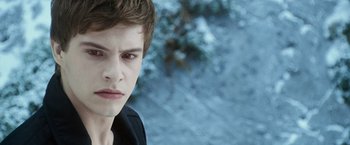 Movie still from “The Twilight Saga: Eclipse” (2010), directed by David Slade – A young man is looking into the distance; Close Up shot, Over the shoulder angle