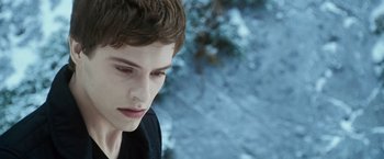 Movie still from “The Twilight Saga: Eclipse” (2010), directed by David Slade – A young man is looking down at the ground; Close Up shot, Over the shoulder angle