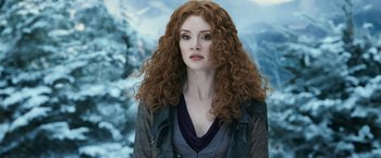 Movie still from “The Twilight Saga: Eclipse” (2010), directed by David Slade – A woman with long curly red hair wearing a blue shirt; Close Up shot, Low angle