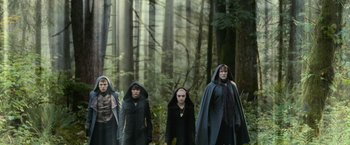 Movie still from “The Twilight Saga: Eclipse” (2010), directed by David Slade – A group of people walking through the woods; Wide shot, Low angle