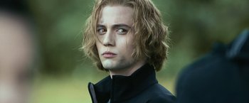 Movie still from “The Twilight Saga: Eclipse” (2010), directed by David Slade – A man with long blonde hair wearing a black jacket; Close Up shot, Over the shoulder angle