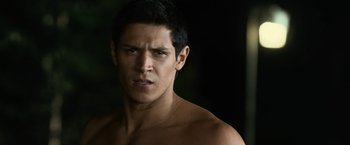 Movie still from “The Twilight Saga: Eclipse” (2010), directed by David Slade – A shirtless man with no shirt is looking at the camera; Close Up shot, Over the shoulder angle