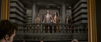 Movie still from “The Twilight Saga: New Moon” (2009), directed by Chris Weitz – A group of men standing next to a railing; Wide shot, Low angle