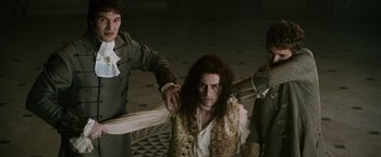 Movie still from “The Twilight Saga: New Moon” (2009), directed by Chris Weitz – A group of men standing next to each other in a room; Medium shot, High angle