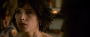 Movie still from “The Twilight Saga: New Moon” (2009), directed by Chris Weitz – A woman's face with a blurry background; Close Up shot, Over the shoulder angle