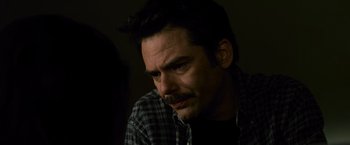 Movie still from “The Twilight Saga: New Moon” (2009), directed by Chris Weitz – A person with a beard and mustache; Close Up shot, Over the shoulder angle