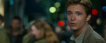 Movie still from “The Twilight Saga: New Moon” (2009), directed by Chris Weitz – A young man with blue eyes stares into the distance; Close Up shot, Over the shoulder angle
