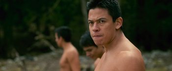 Movie still from “The Twilight Saga: New Moon” (2009), directed by Chris Weitz – A man with no shirt in front of two other men; Close Up shot, Over the shoulder angle