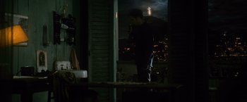 Movie still from “The Twilight Saga: New Moon” (2009), directed by Chris Weitz – A man standing in front of a window at night; Wide shot, High angle