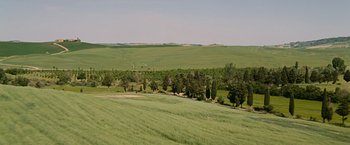 Movie still from “The Twilight Saga: New Moon” (2009), directed by Chris Weitz – A green field with trees in the background; Extreme Wide shot, High angle
