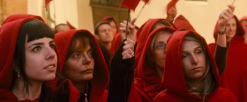 Movie still from “The Twilight Saga: New Moon” (2009), directed by Chris Weitz – A group of people wearing red hoods and holding red flags; Close Up shot, High angle