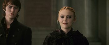 Movie still from “The Twilight Saga: New Moon” (2009), directed by Chris Weitz – A young woman in a black dress is looking at the camera; Close Up shot, Over the shoulder angle