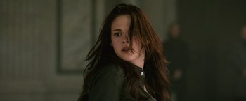 Movie still from “The Twilight Saga: New Moon” (2009), directed by Chris Weitz – A beautiful young woman with long , brown hair; Close Up shot, Over the shoulder angle