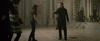Movie still from “The Twilight Saga: New Moon” (2009), directed by Chris Weitz – A man and a woman are standing in an empty room; Medium shot, Over the shoulder angle