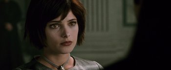 Movie still from “The Twilight Saga: New Moon” (2009), directed by Chris Weitz – A person wearing a necklace; Close Up shot, Over the shoulder angle