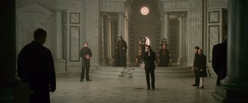 Movie still from “The Twilight Saga: New Moon” (2009), directed by Chris Weitz – A group of people standing in front of a building; Wide shot, Low angle