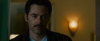 Movie still from “The Twilight Saga: New Moon” (2009), directed by Chris Weitz – A person with a beard and mustache; Close Up shot, Over the shoulder angle