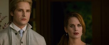 Movie still from “The Twilight Saga: New Moon” (2009), directed by Chris Weitz – A man and a woman standing next to each other; Close Up shot, Over the shoulder angle