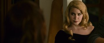 Movie still from “The Twilight Saga: New Moon” (2009), directed by Chris Weitz – A woman with long blonde hair looking into a mirror; Close Up shot, Over the shoulder angle