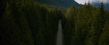 Movie still from “The Twilight Saga: New Moon” (2009), directed by Chris Weitz – A car driving down a road in the middle of a forest; Extreme Wide shot, High angle