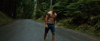 Movie still from “The Twilight Saga: New Moon” (2009), directed by Chris Weitz – A man standing on the side of a road; Wide shot, High angle