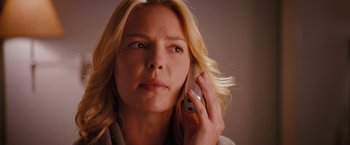 Movie still from “The Ugly Truth” (2009), directed by Robert Luketic – A woman holding a cell phone up to her ear; Close Up shot, Low angle