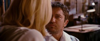 Movie still from “The Ugly Truth” (2009), directed by Robert Luketic – A person looking at another person; Close Up shot, Over the shoulder angle