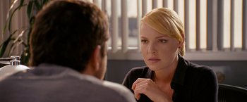 Movie still from “The Ugly Truth” (2009), directed by Robert Luketic – A man and a woman sitting at a table talking to each other; Close Up shot, Over the shoulder angle