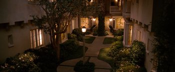Movie still from “The Ugly Truth” (2009), directed by Robert Luketic – A walkway in the middle of a building at night; Extreme Wide shot, High angle