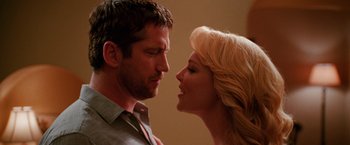 Movie still from “The Ugly Truth” (2009), directed by Robert Luketic – A man and a woman face to face in front of a wall; Close Up shot, Low angle