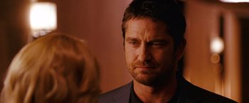 Movie still from “The Ugly Truth” (2009), directed by Robert Luketic – A person looking at another person; Close Up shot, Over the shoulder angle