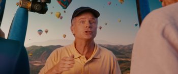 Movie still from “The Ugly Truth” (2009), directed by Robert Luketic – A man in a yellow shirt and a black hat; Close Up shot, Overhead angle