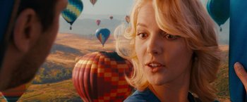 Movie still from “The Ugly Truth” (2009), directed by Robert Luketic – A woman with blonde hair standing in front of balloons; Close Up shot, Over the shoulder angle