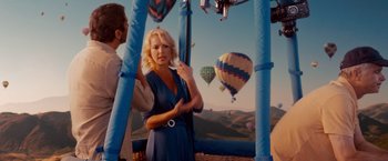 Movie still from “The Ugly Truth” (2009), directed by Robert Luketic – A woman standing next to a man in front of a hot air balloon; Wide shot, Low angle