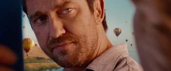 Movie still from “The Ugly Truth” (2009), directed by Robert Luketic – A person with a beard; Close Up shot, Over the shoulder angle