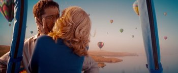 Movie still from “The Ugly Truth” (2009), directed by Robert Luketic – A man and a woman looking out over a body of water; Medium shot, Overhead angle