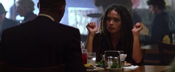 Movie still from “Enemy of the State” (1998), directed by Tony Scott – A woman sitting at a dinner table with a man; Close Up shot, Over the shoulder angle