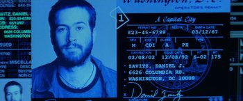 Movie still from “Enemy of the State” (1998), directed by Tony Scott – A man's id card and a picture of him; Extreme Close Up shot, Overhead angle