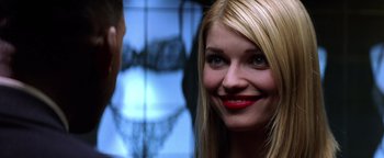 Movie still from “Enemy of the State” (1998), directed by Tony Scott – A woman with red lipstick looking at a man; Close Up shot, Over the shoulder angle