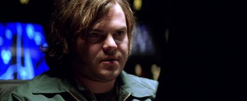 Movie still from “Enemy of the State” (1998), directed by Tony Scott – A person with long hair; Close Up shot, Over the shoulder angle