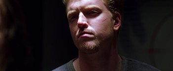 Movie still from “Enemy of the State” (1998), directed by Tony Scott – A person with a beard; Close Up shot, Low angle