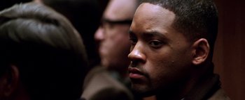 Movie still from “Enemy of the State” (1998), directed by Tony Scott – Will smith's face as he stares into the distance; Close Up shot, Over the shoulder angle