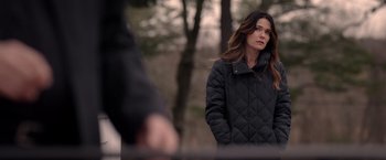 Movie still from “The Unholy” (2021), directed by Evan Spiliotopoulos – A woman in a black jacket standing in front of a fence; Close Up shot, Over the shoulder angle