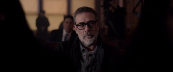 Movie still from “The Unholy” (2021), directed by Evan Spiliotopoulos – A person wearing glasses and a jacket; Close Up shot, Over the shoulder angle