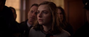 Movie still from “The Unholy” (2021), directed by Evan Spiliotopoulos – A young woman with long brown hair is looking to her left; Close Up shot, Over the shoulder angle