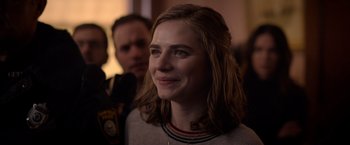 Movie still from “The Unholy” (2021), directed by Evan Spiliotopoulos – A person with a person in the background; Close Up shot, Over the shoulder angle